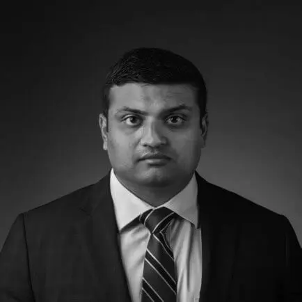 Attorneys 20 Black and white portrait photo of Thomas J. Henry Attorney Chirag N. Desai