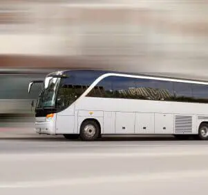 Man Charged with 8 Criminal Offenses for Bus Theft, Murder 1 Tour bus with added motion blur
