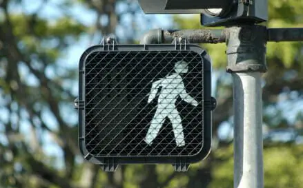 16-year-old Pedestrian Struck and Killed by Hit-and-Run Motorist 1 Pedestrian crosswalk signal with walk illuminated