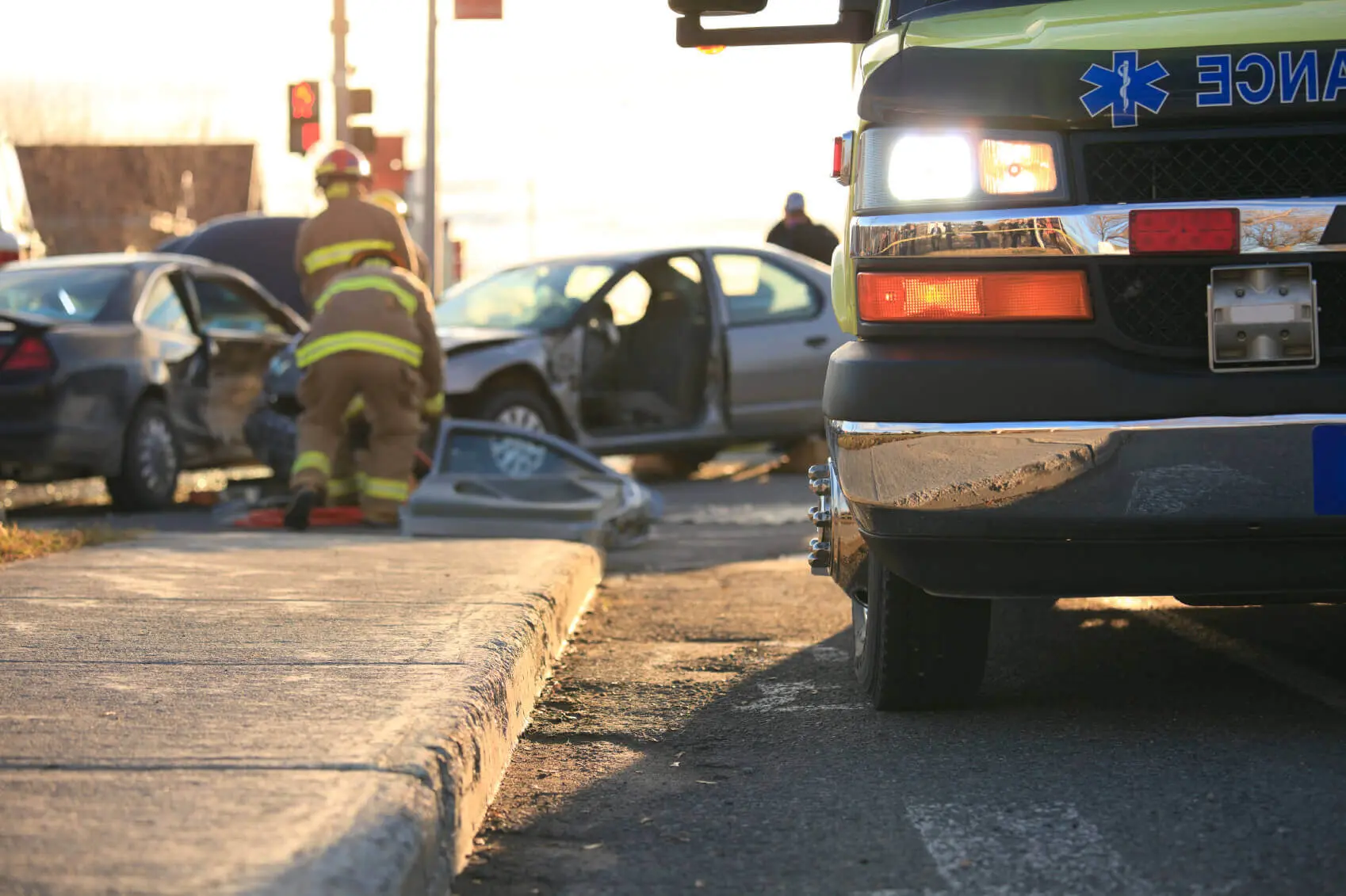 Why You Should Always Call an Austin Car Accident Lawyer After a Crash 1 Car accident with firefighters and ambulance