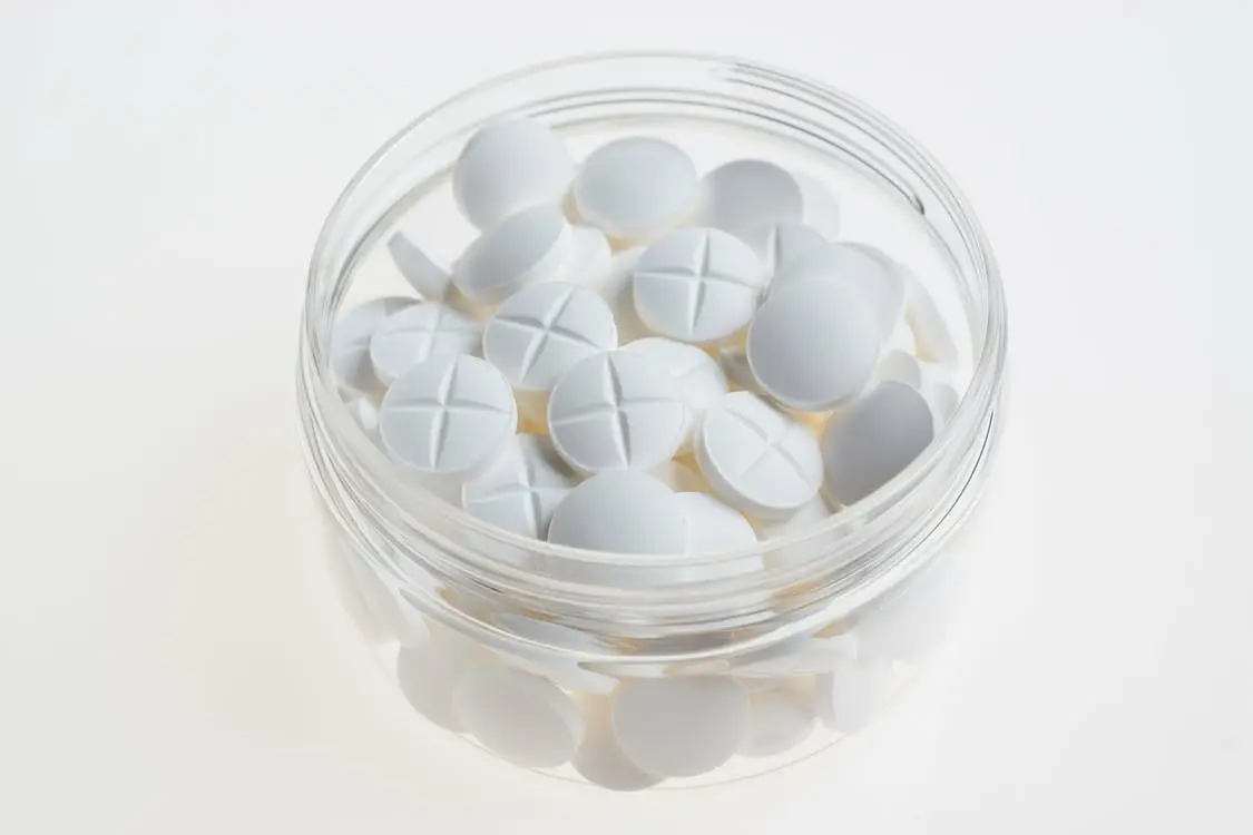 Purdue Pharma Sued Over Opioid Profiting 1 White tablets in glass container