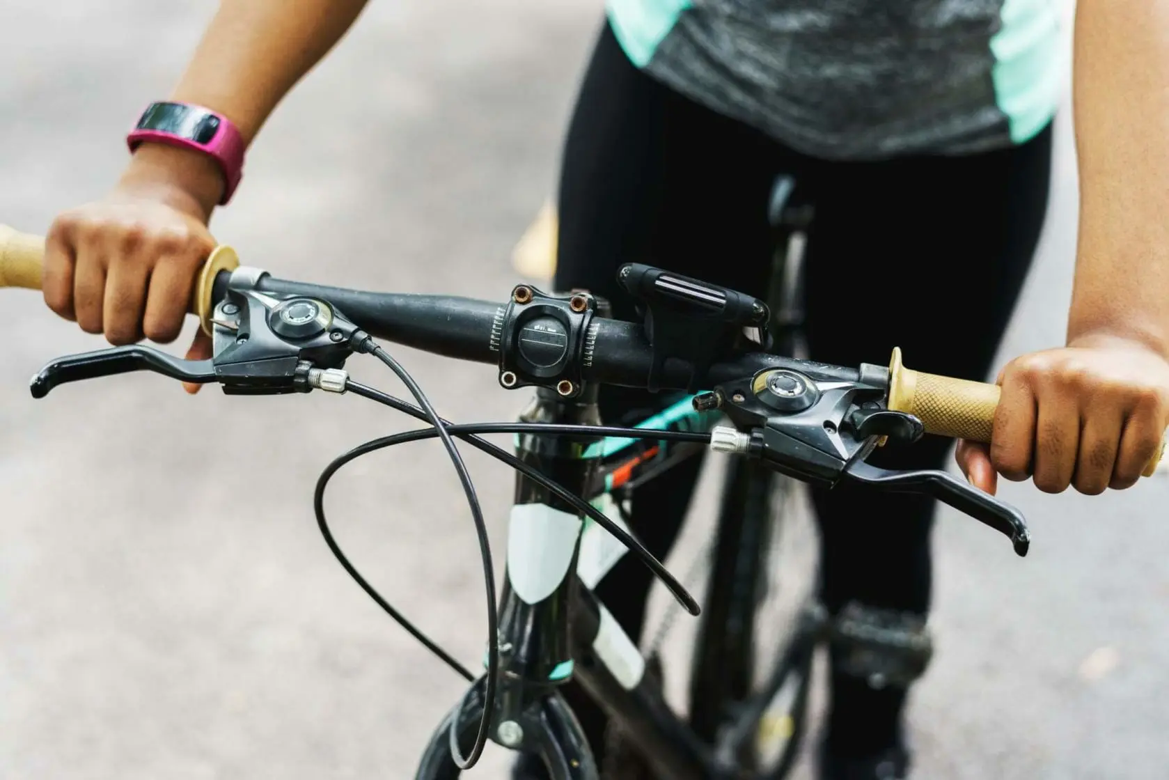 Blog 7 Cropped shot of a woman holding her bicycle handle