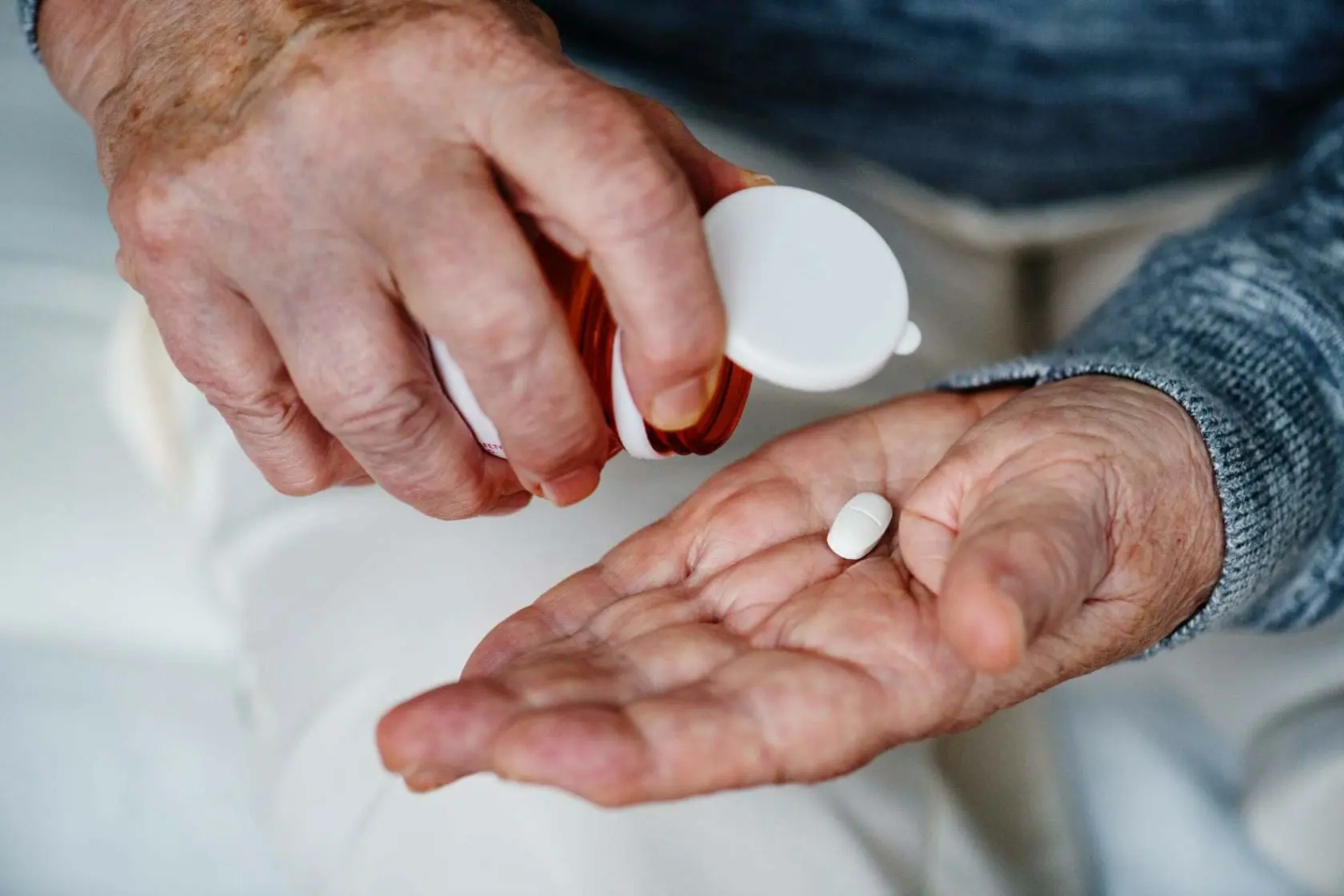Zantac Heartburn Tablets Under Fire by FDA 1 Elderly man taking medication