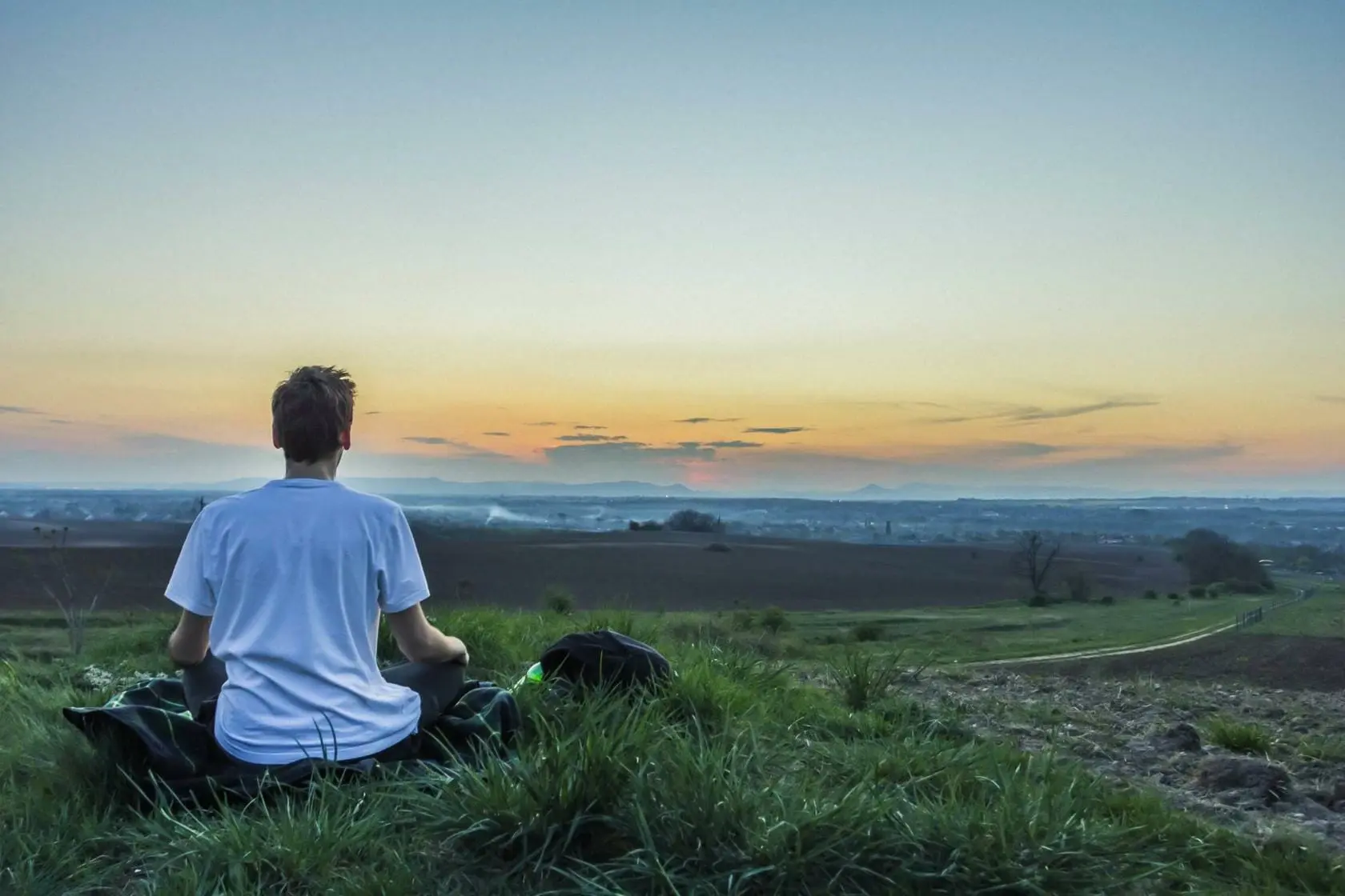 Wellness: 10 Tips to Decrease Depression and Improve Mental Health 1 Man meditation on field looking at sunset