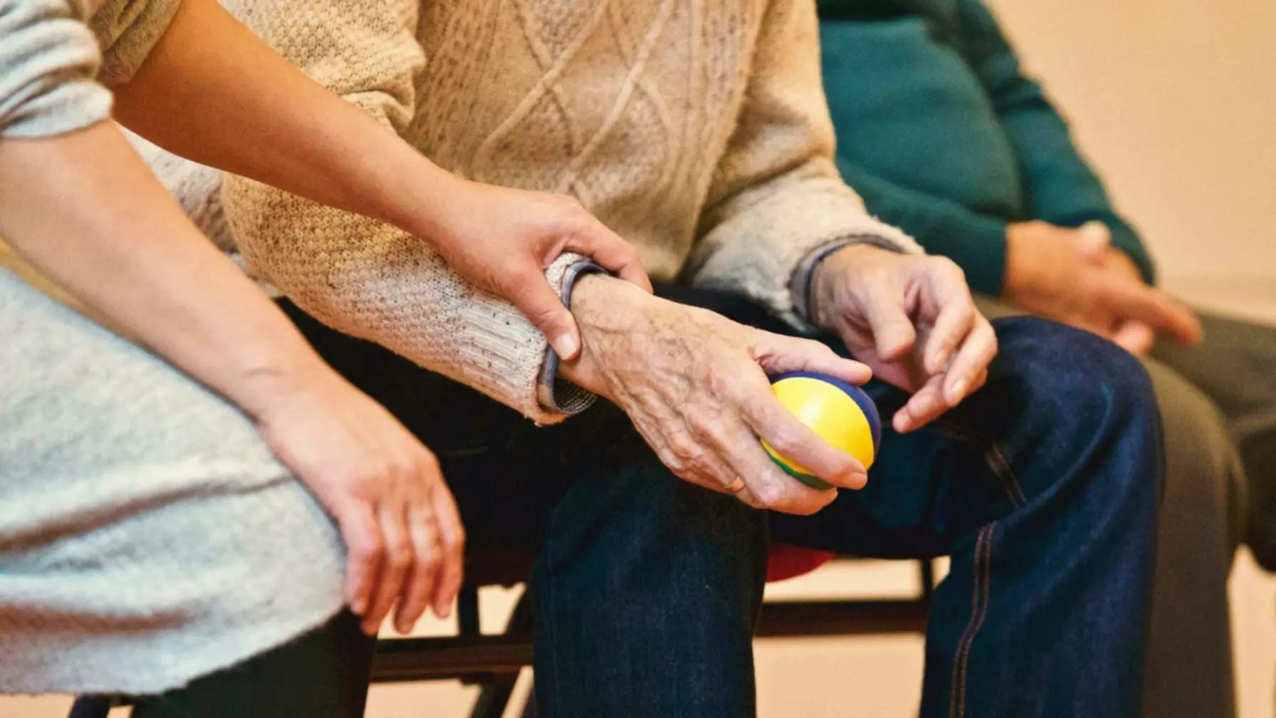 Nursing Home Neglect Attorney: Signs Your Loved One is a Victim 1 Elderly patient holding a stress ball in being comforted