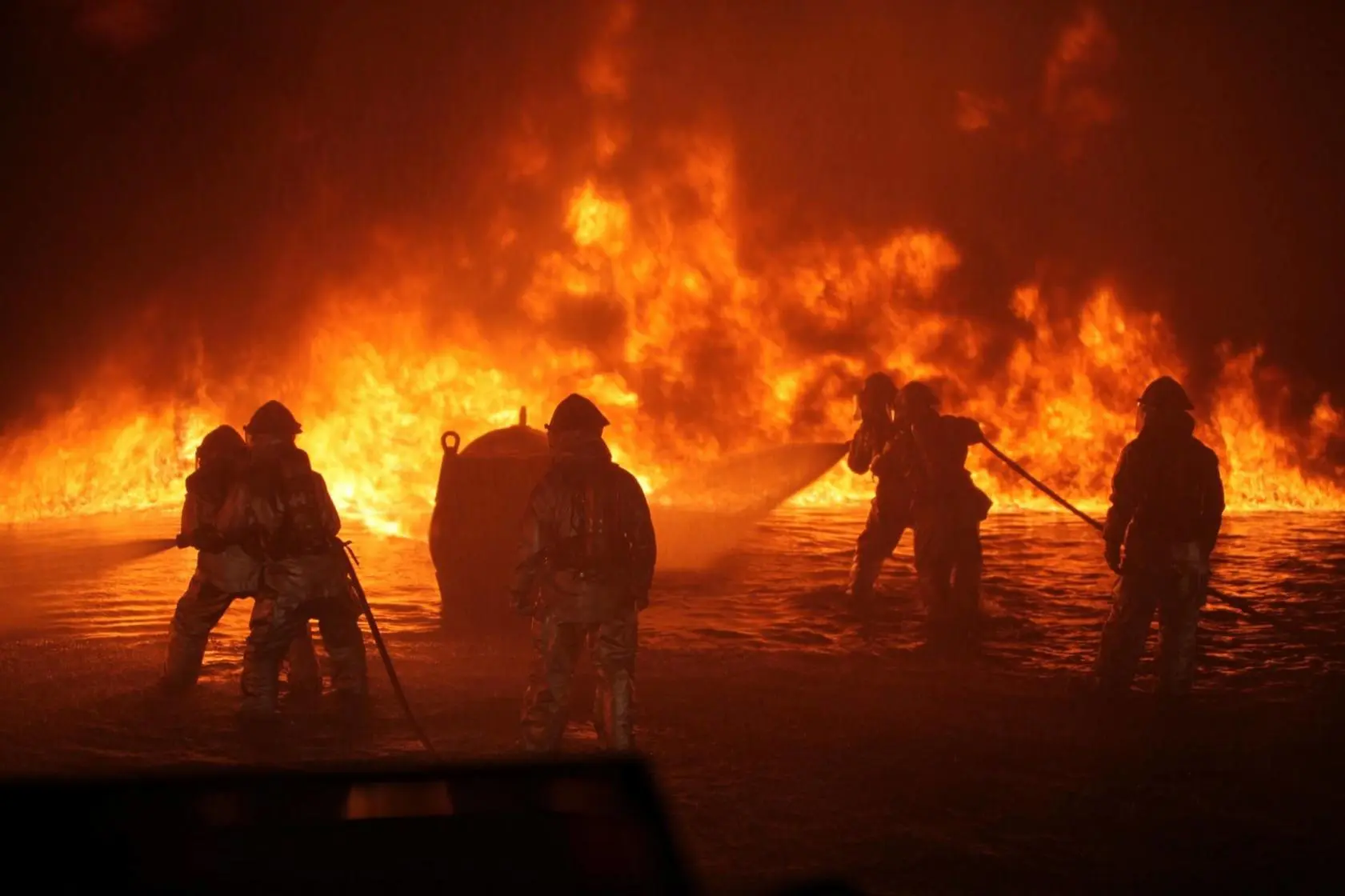 Horrific Alabama Fire Destroys Over 30 Boats and Kills 8 People 1 Firefighters putting out industrial fire