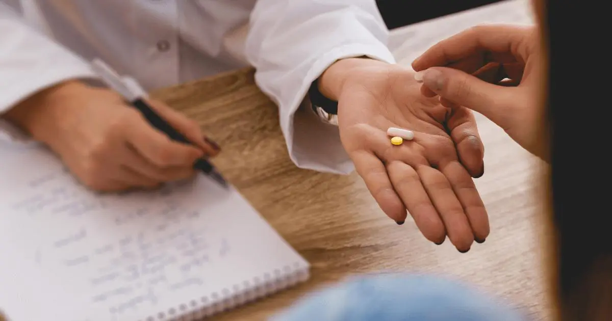 Blog 1 Woman being handed medication
