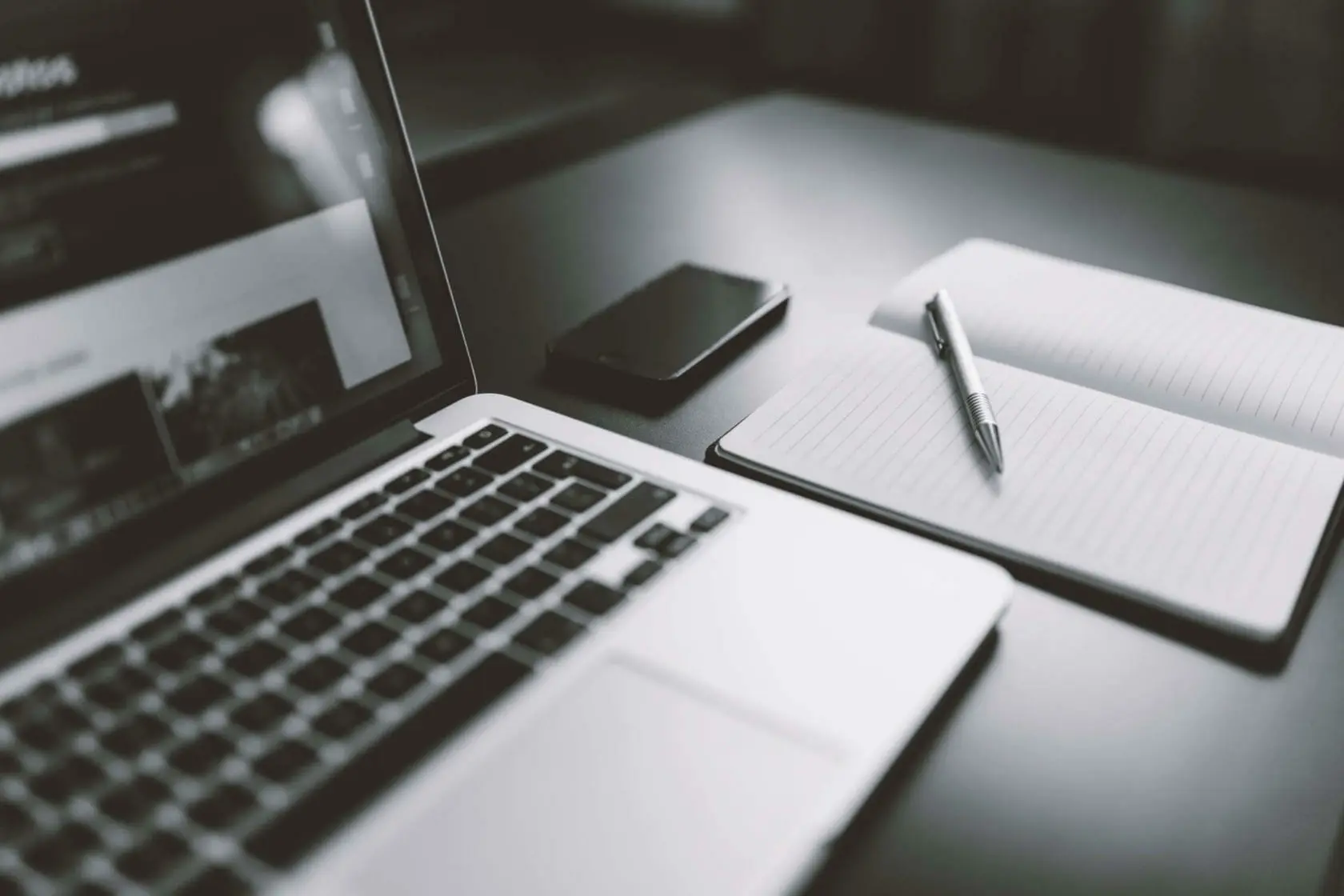 Laptop with pen and pad