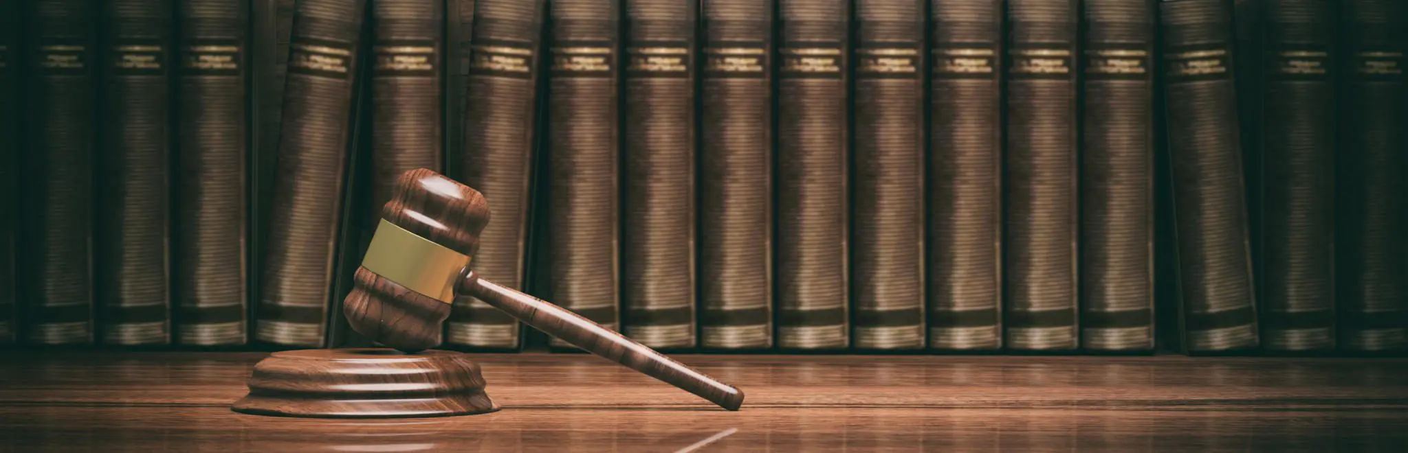 Blog 2 Legal gavel and books symbolizing law and justice.