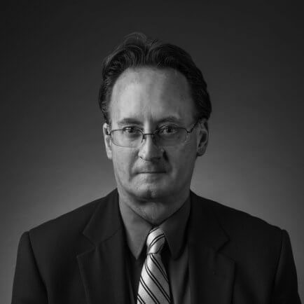 Black and white portrait photo of Thomas J. Henry Attorney Kevin A. Norris