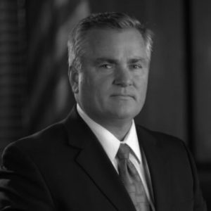 Black and white portrait photo of Thomas J. Henry Attorney Michael E. Henry