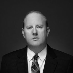 Black and white portrait photo of Thomas J. Henry AttorneyTravis Venable