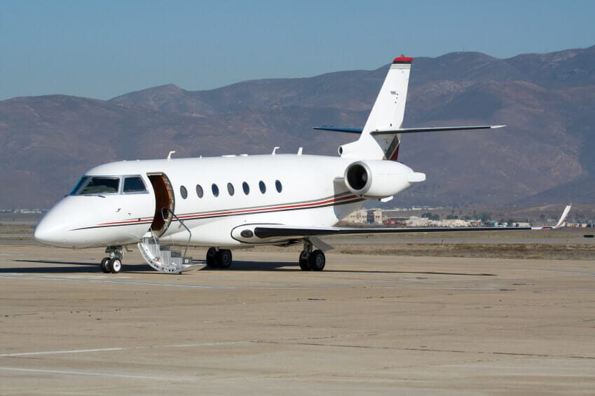 Business jet parked on runway