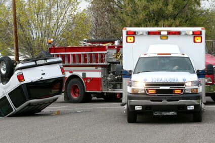 Ambulance and fire engine parked at car accident