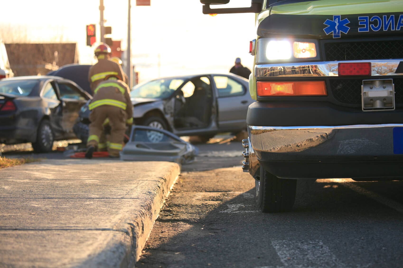 Car accident with firefighters and ambulance