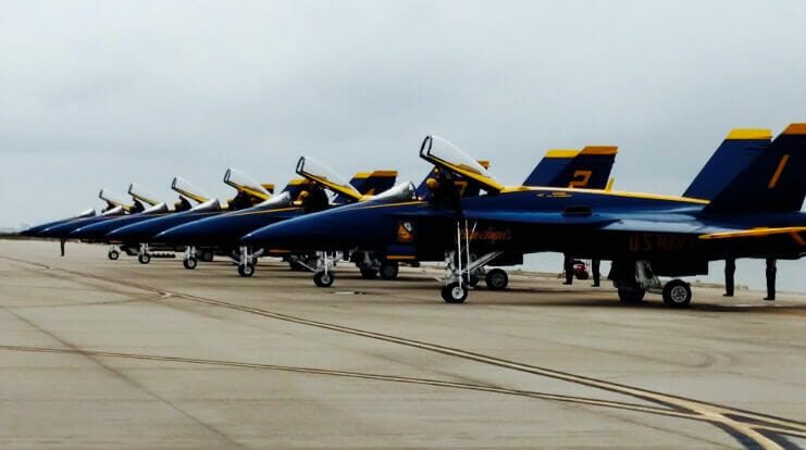 Blue and yellow jets on runway