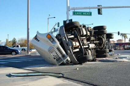 Flipped over 18-wheeler truck on intersection
