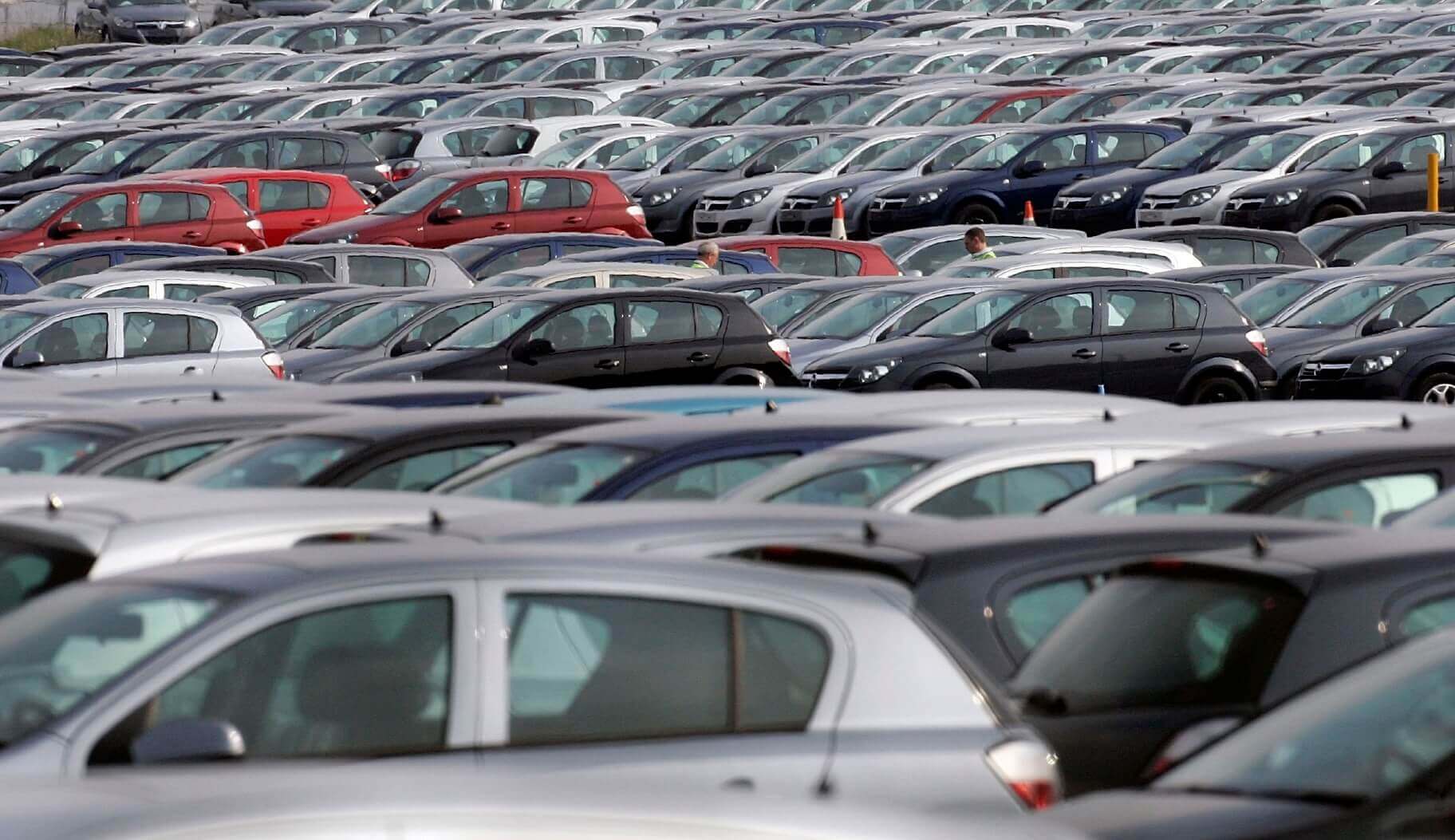 Car lot with various cars parked