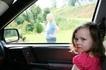 Child waiting in the car for mother