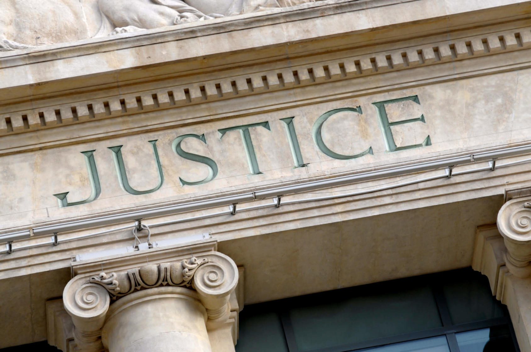 Justice sign on a Law Courts building in France.