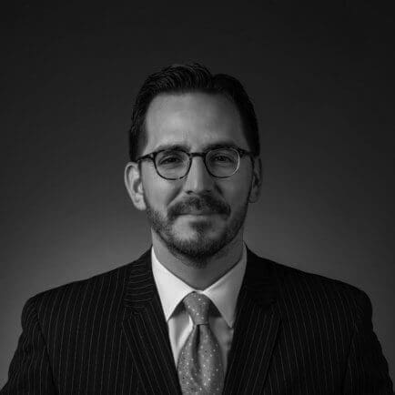 Black and white portrait photo of Thomas J. Henry Attorney Steven G. Marquez