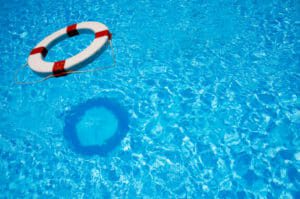 Safety life tube floating in bright blue water