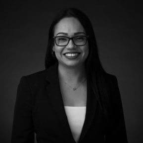 Black and white portrait photo of Thomas J. Henry Attorney Claudia Y. Polendo