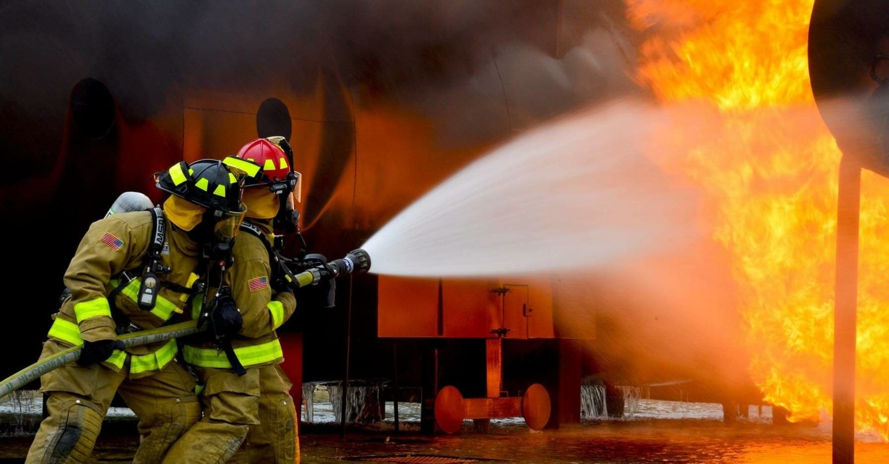 Firefighters putting out industrial fire