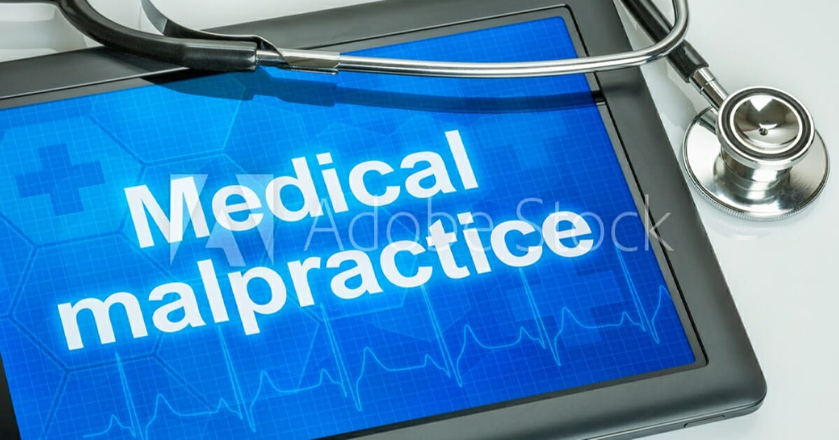 Medical Malpractice on tablet with stethoscope