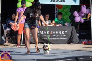 Dog and owner on stage at 2019 Bark in the Park San Antonio